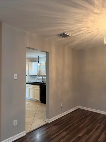 a view of a kitchen with a sink and dishwasher