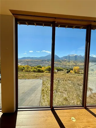 a view of a room with a large window