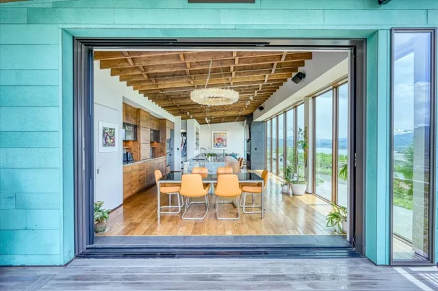 a view of living room with furniture and floor to ceiling window