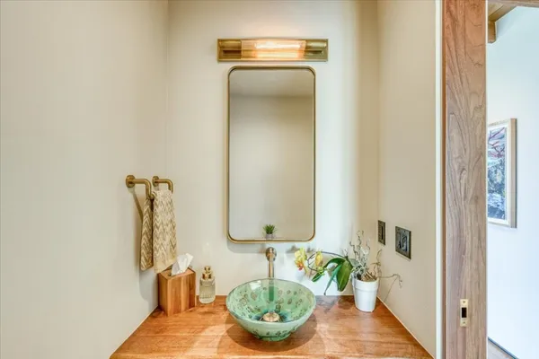 a bathroom with a sink and a mirror