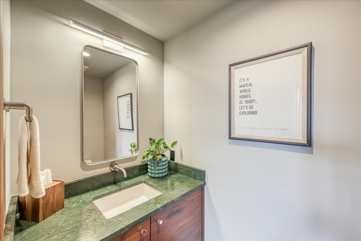 421 Z Road Silverthorne, CO 80498 - Photo 27 of 47 a bathroom with a granite countertop sink and a mirror