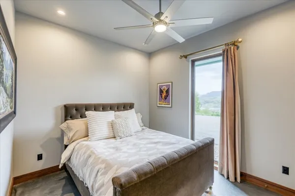 a bedroom with bed and a window