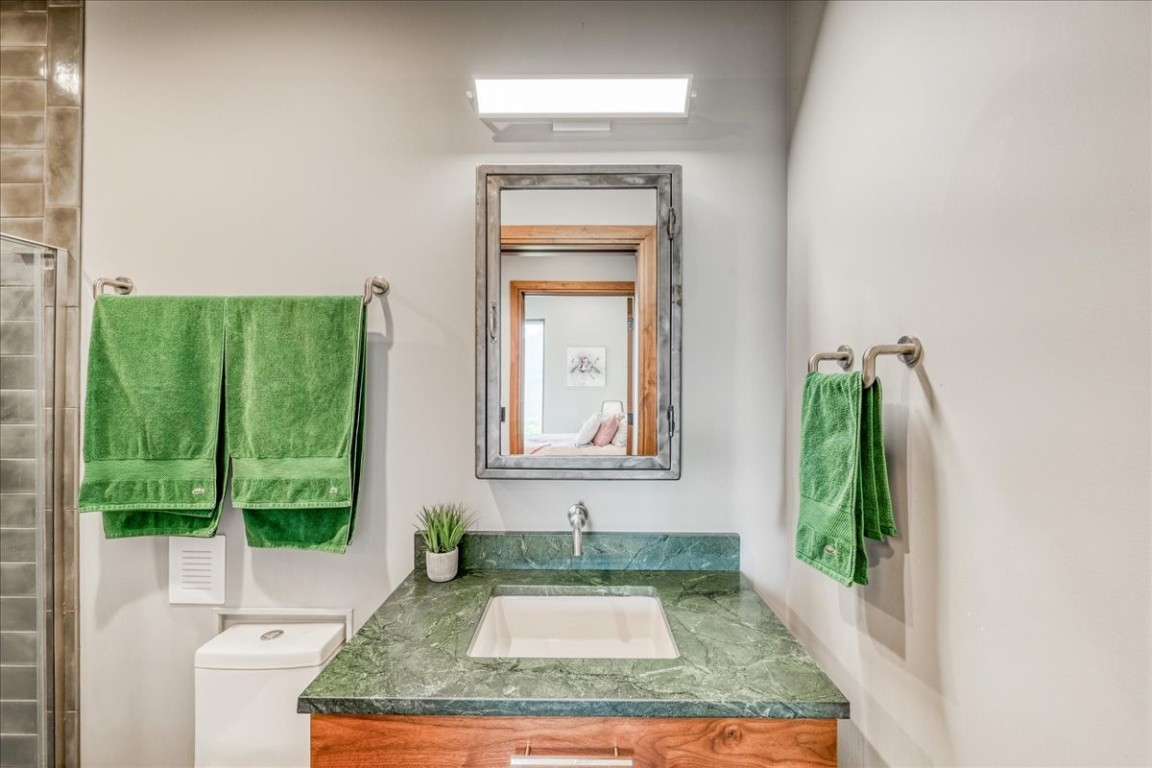 421 Z Road Silverthorne, CO 80498 - Photo 29 of 47 a bathroom with a granite countertop sink and mirror