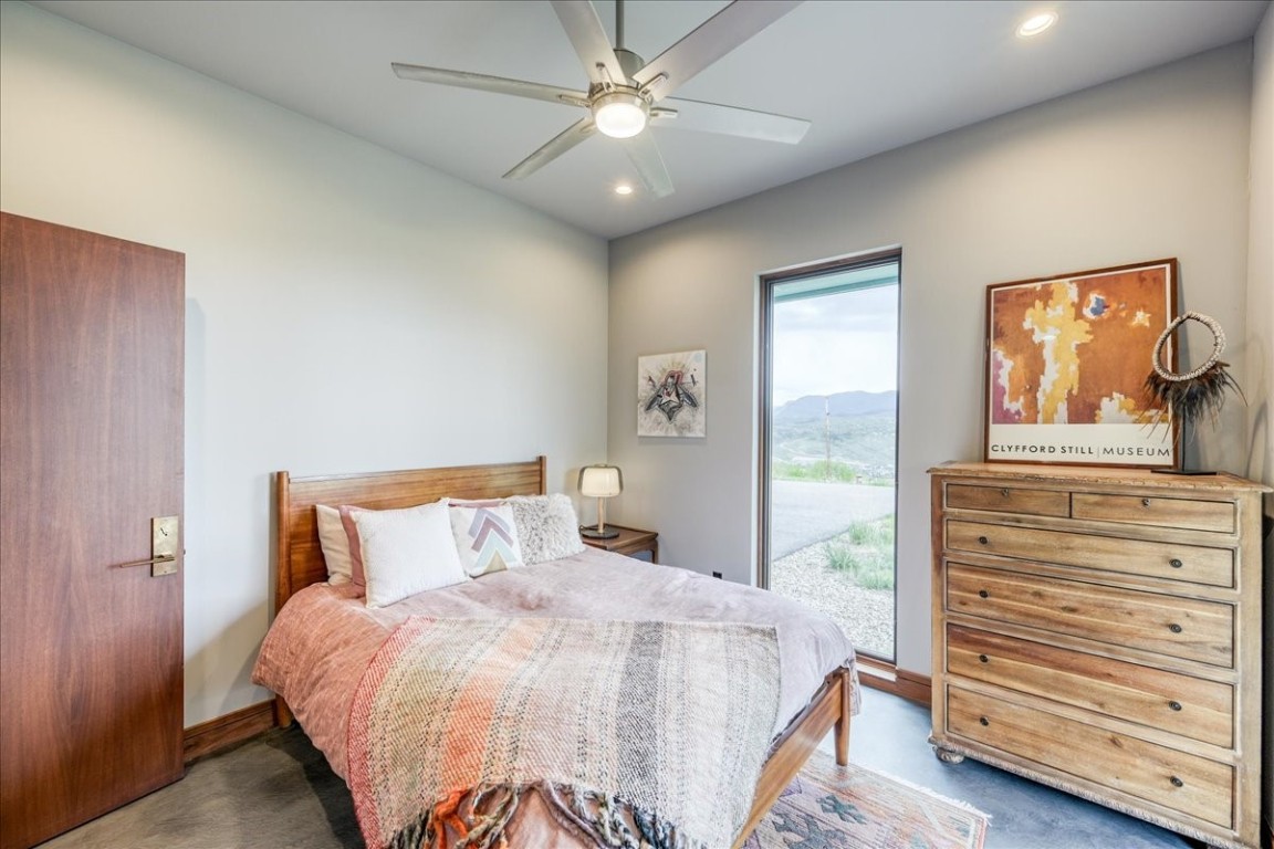421 Z Road Silverthorne, CO 80498 - Photo 32 of 47 a bedroom with a bed and a painting on the wall