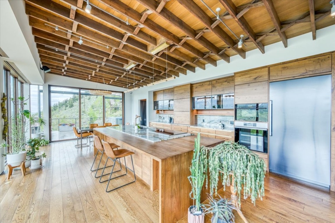 421 Z Road Silverthorne, CO 80498 - Photo 4 of 47 a view of a dining room with furniture wooden floor and a rug
