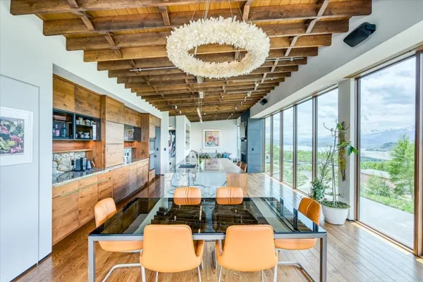 a view of a dining room with furniture window and outside view