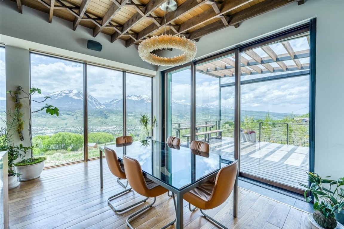 421 Z Road Silverthorne, CO 80498 - Photo 9 of 47 a view of a dining room with furniture wooden floor and a potted plant