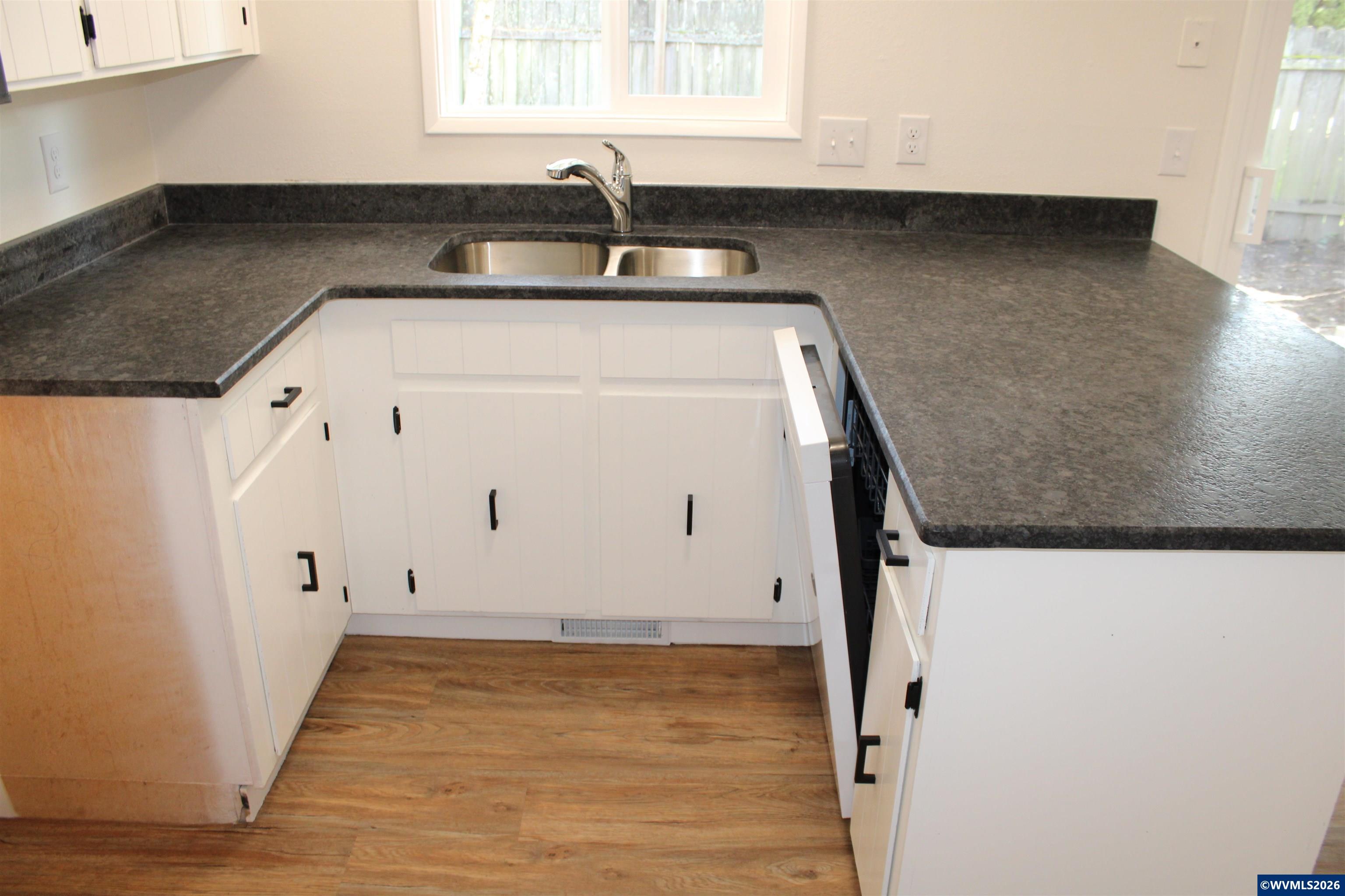 6259 Chapman Place Southwest Albany, OR 97321 - Photo 8 of 21 a close view of a sink a window and a kitchen counter