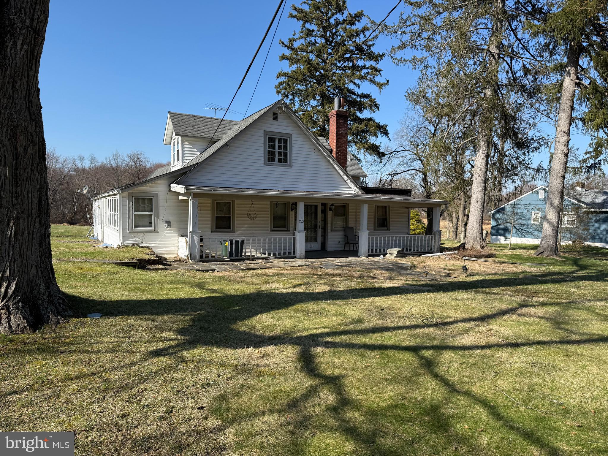 a view of a house with swimming pool and a yard