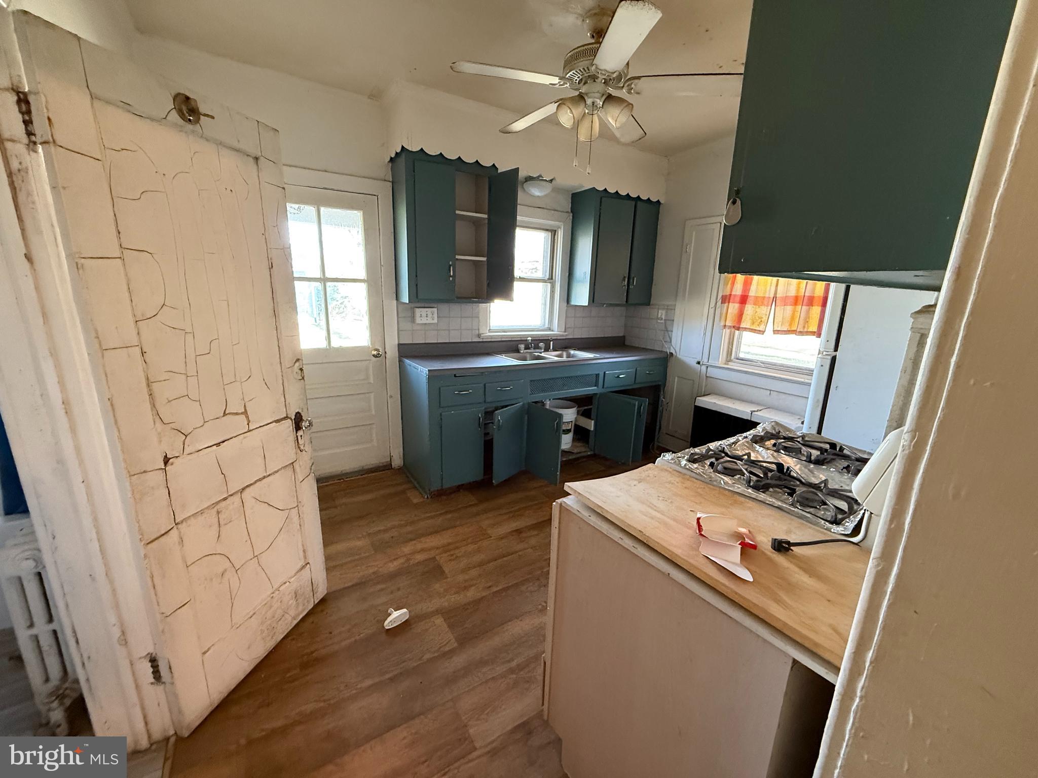 253 Penn Hopewell Road Hopewell, NJ 08525 - Photo 7 of 9 a kitchen that has a sink and a stove in it