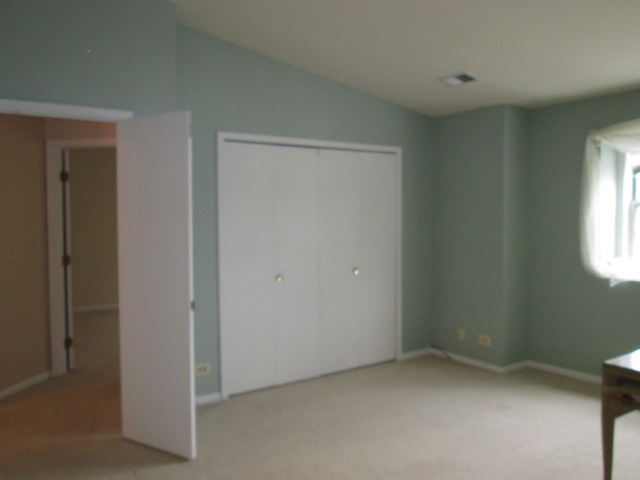 2426 Raleigh Court, Unit 6 Schaumburg, IL 60193 - Photo 13 of 18 a view of an empty room and a window