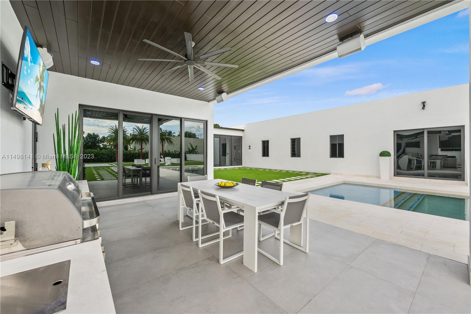 13310 Southwest 34th Street Miami, FL 33175 - Photo 14 of 54 a view of a patio with a table and chairs