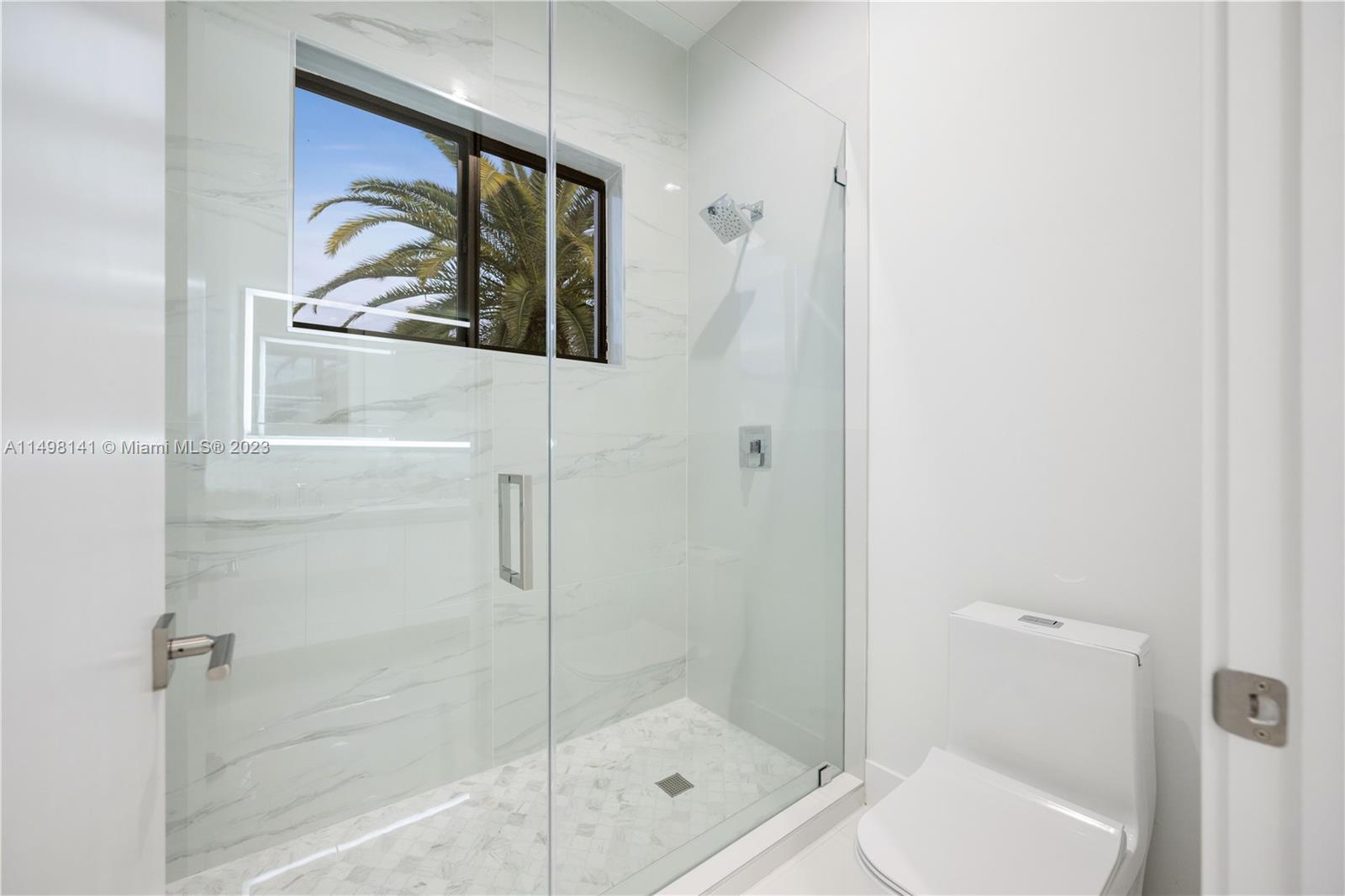 13310 Southwest 34th Street Miami, FL 33175 - Photo 15 of 54 a bathroom with a shower and toilet