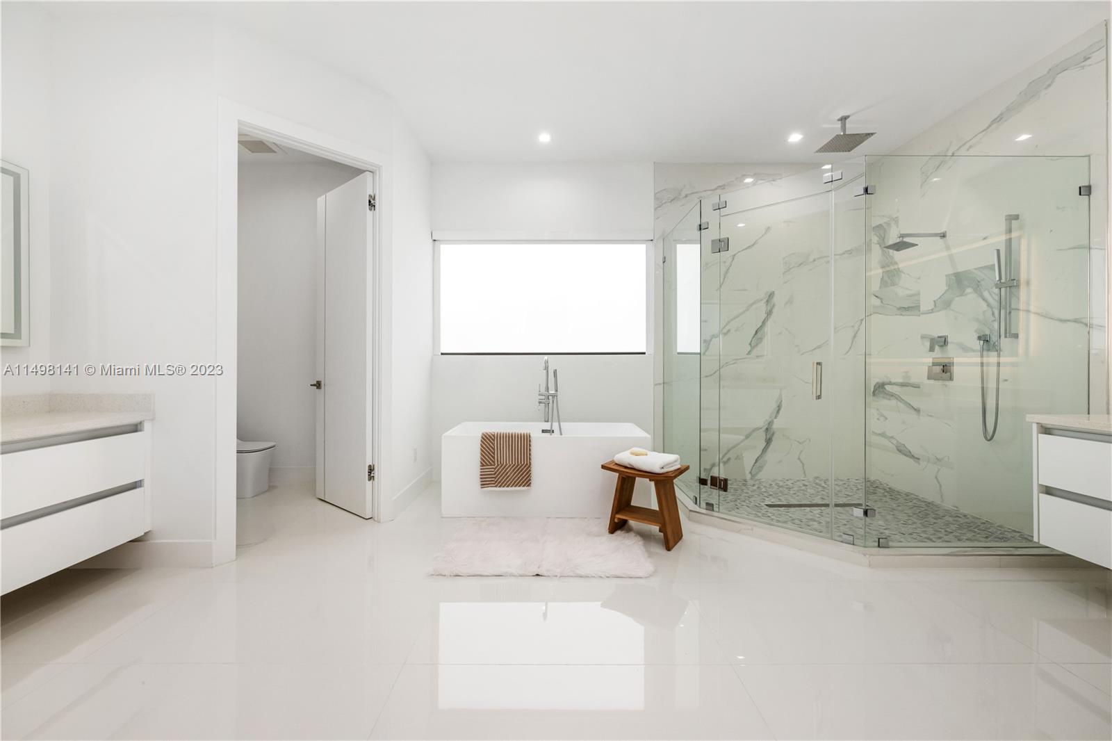 13310 Southwest 34th Street Miami, FL 33175 - Photo 18 of 54 a bathroom with a sink toilet tub and shower