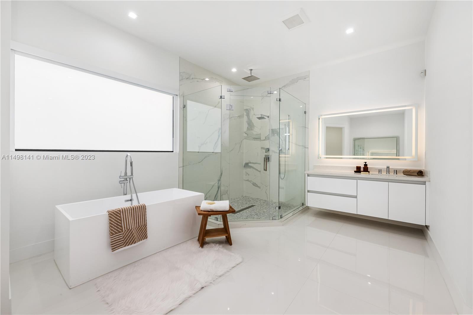 13310 Southwest 34th Street Miami, FL 33175 - Photo 19 of 54 a bathroom with a sink a toilet and bathtub