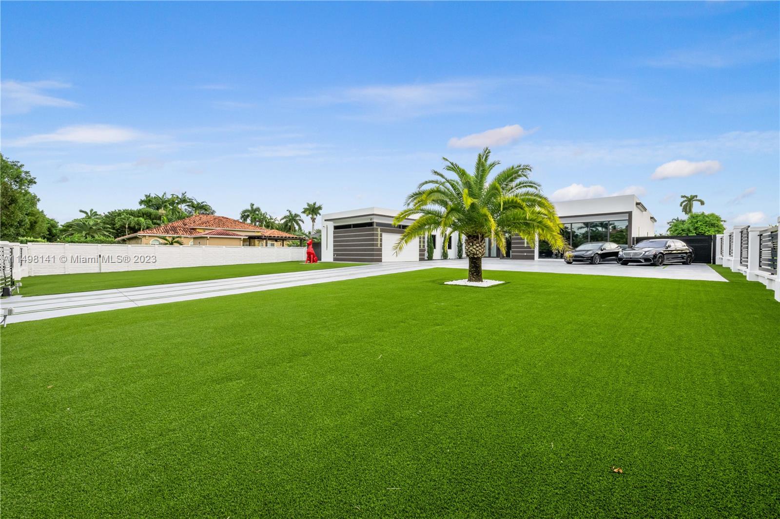 13310 Southwest 34th Street Miami, FL 33175 - Photo 27 of 54 a view of a garden with a building in the background