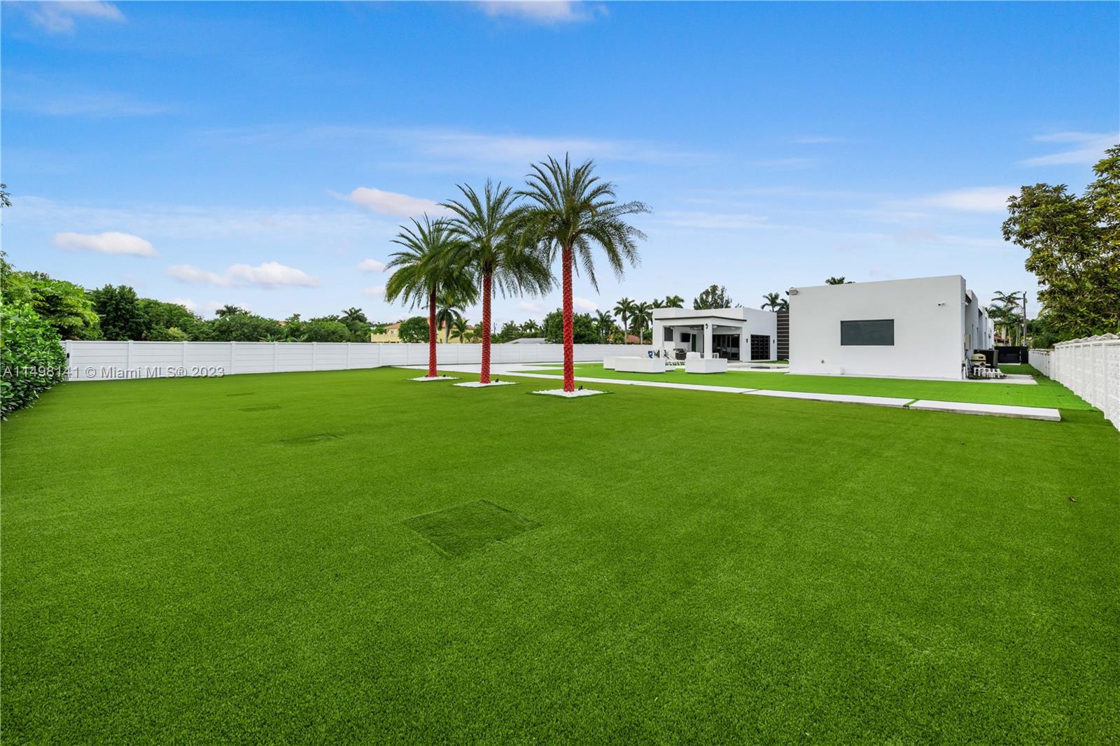 13310 Southwest 34th Street Miami, FL 33175 - Photo 36 of 54 a swimming pool with outdoor seating and yard