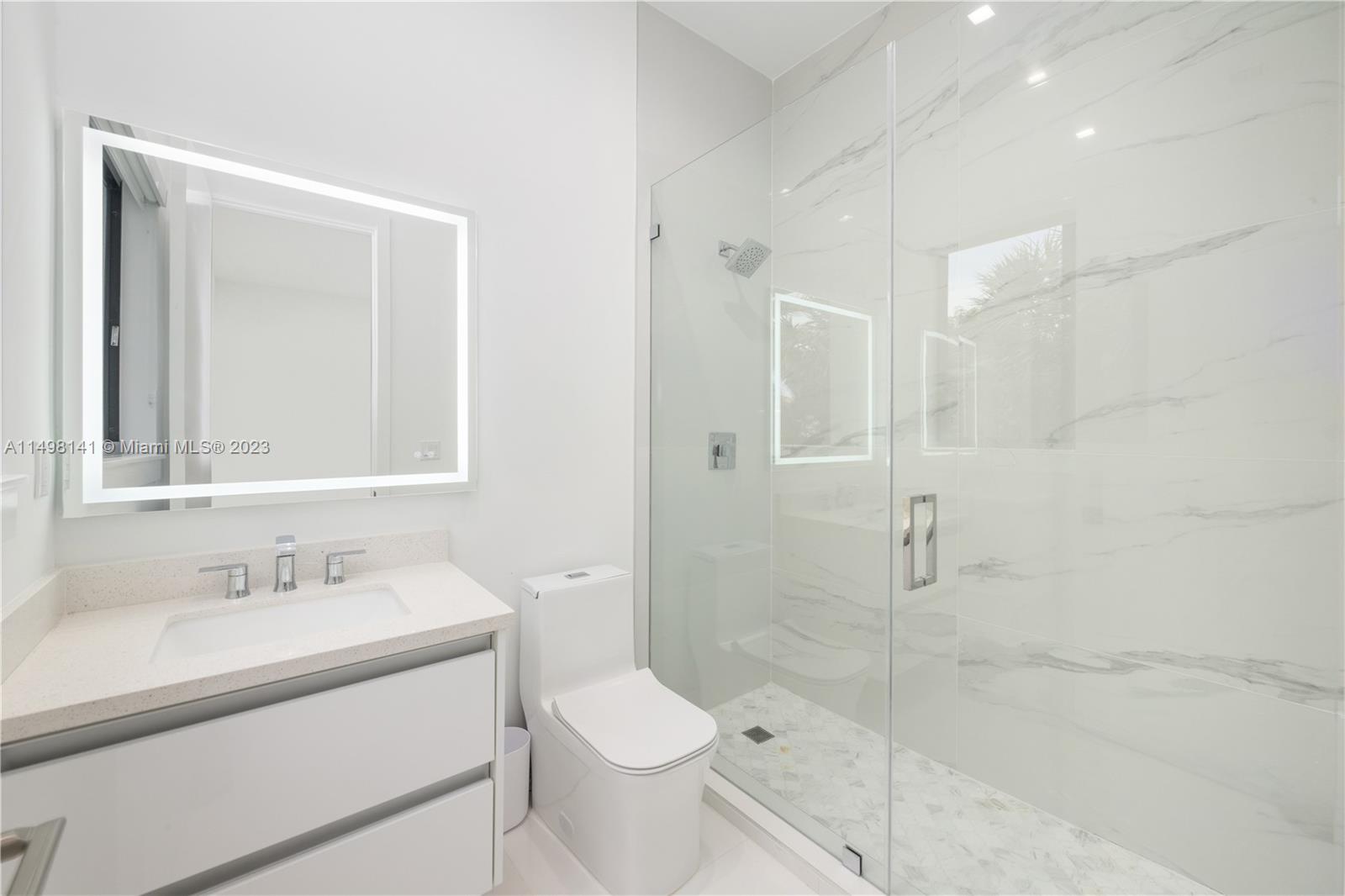 13310 Southwest 34th Street Miami, FL 33175 - Photo 39 of 54 a bathroom with a sink a toilet and shower