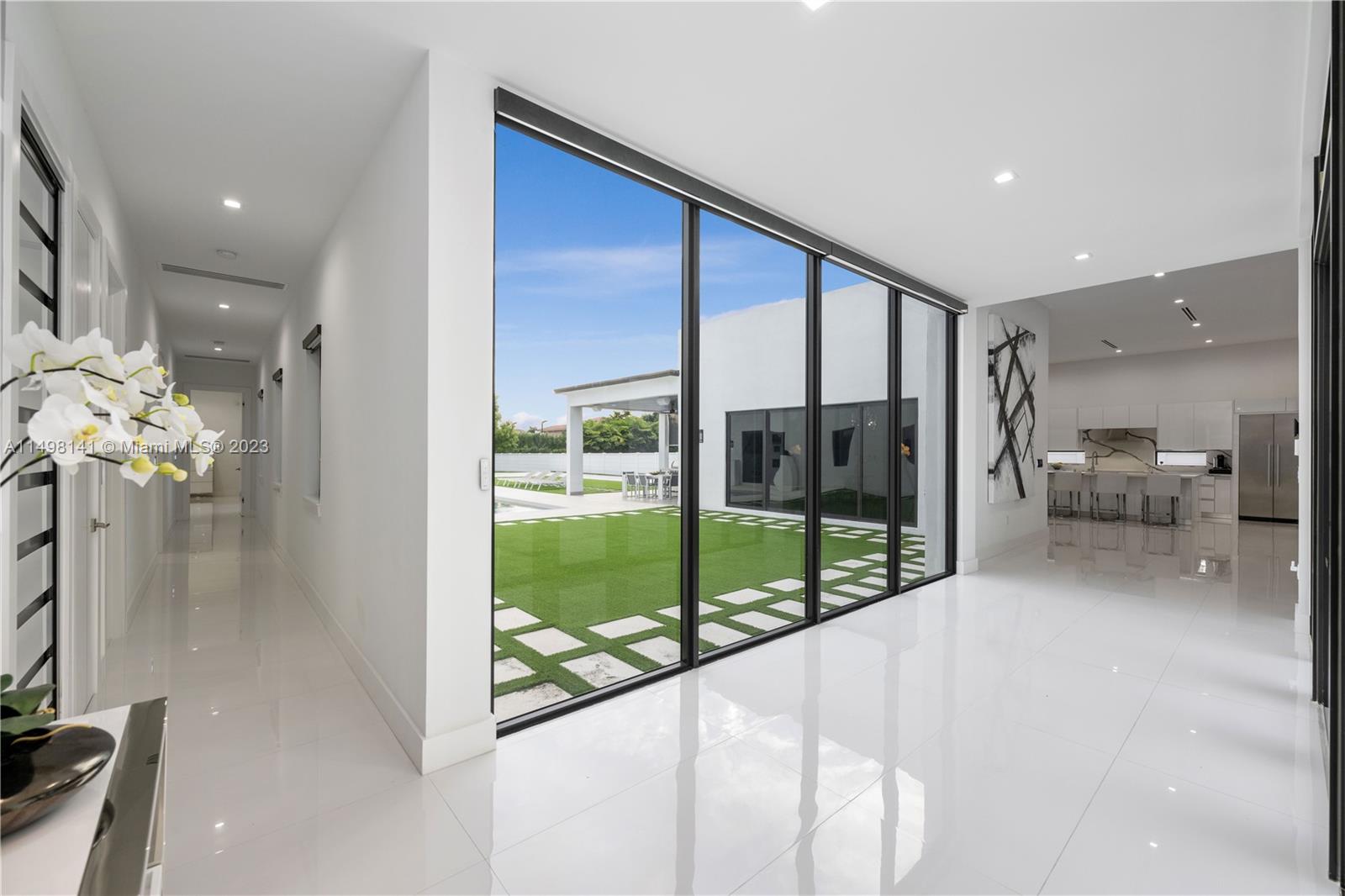 13310 Southwest 34th Street Miami, FL 33175 - Photo 4 of 54 a view of a living room and a floor to ceiling window