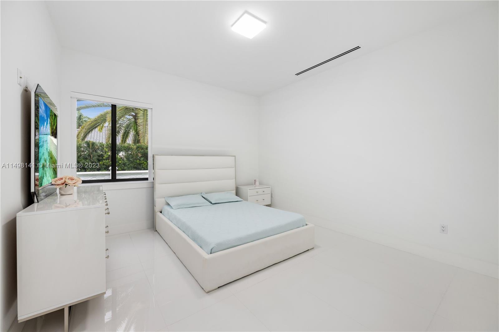 13310 Southwest 34th Street Miami, FL 33175 - Photo 41 of 54 a room with a bed and a large window