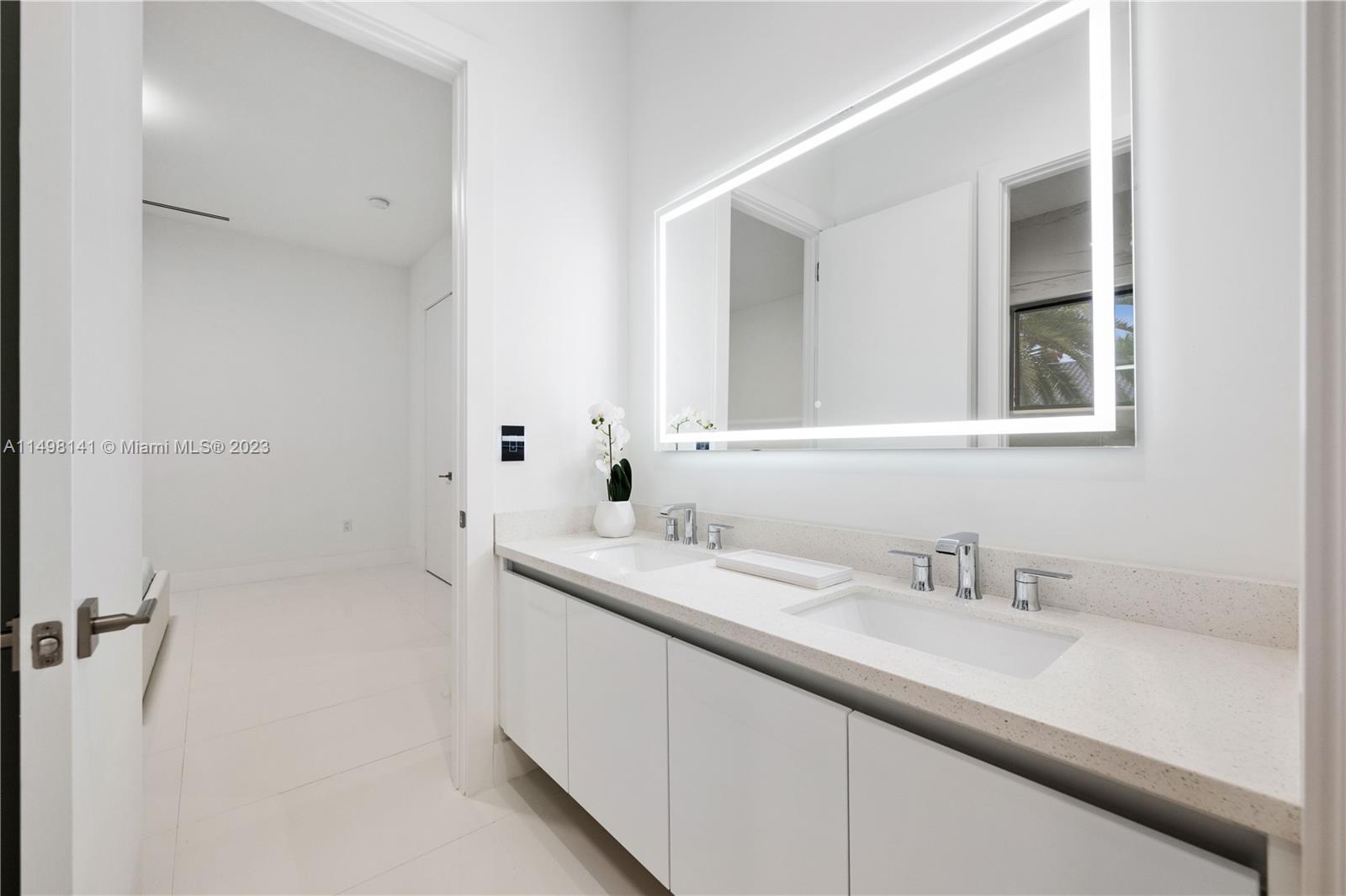 13310 Southwest 34th Street Miami, FL 33175 - Photo 42 of 54 a bathroom with a sink and a mirror