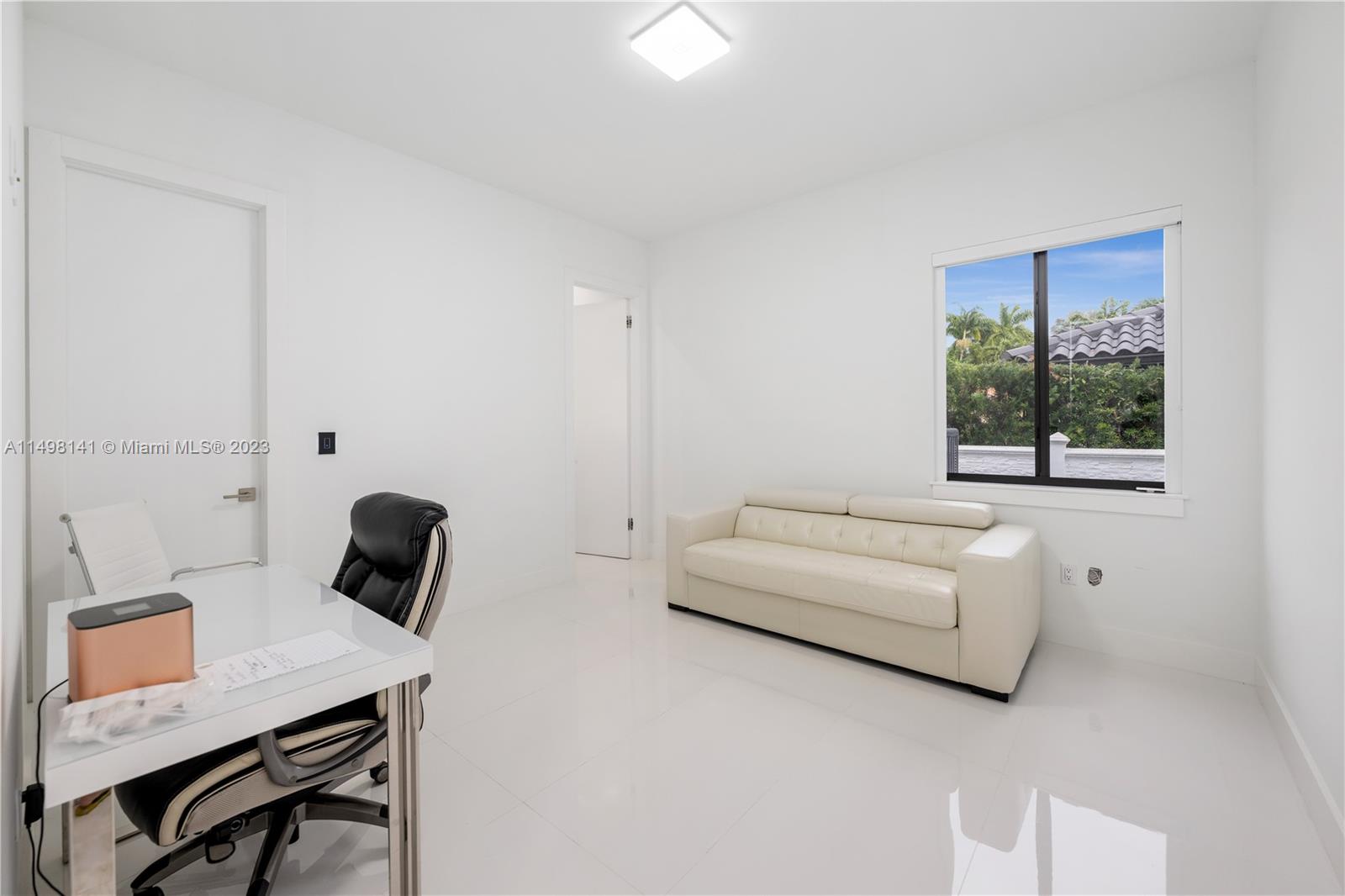 13310 Southwest 34th Street Miami, FL 33175 - Photo 44 of 54 a bedroom with furniture and a window