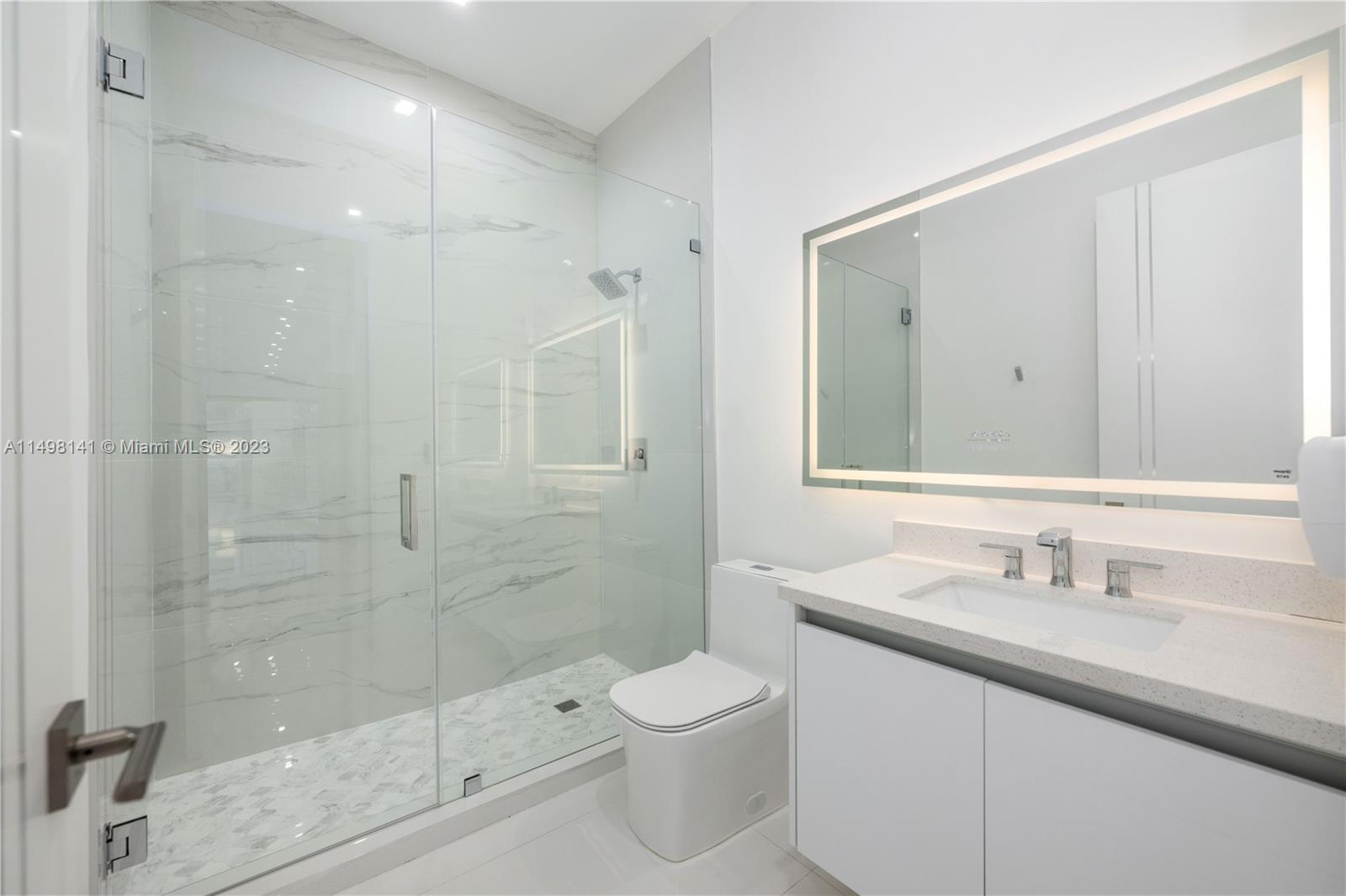 13310 Southwest 34th Street Miami, FL 33175 - Photo 45 of 54 a bathroom with a sink a toilet and shower