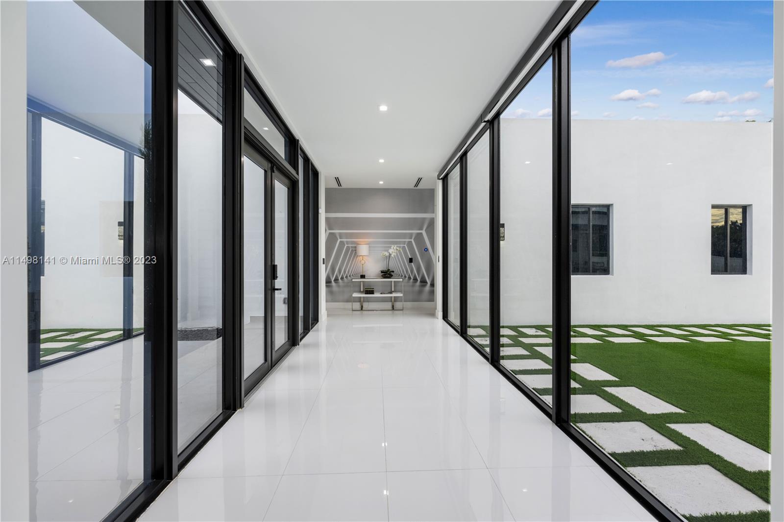 13310 Southwest 34th Street Miami, FL 33175 - Photo 5 of 54 a view of a hallway with the view of living room and entryway