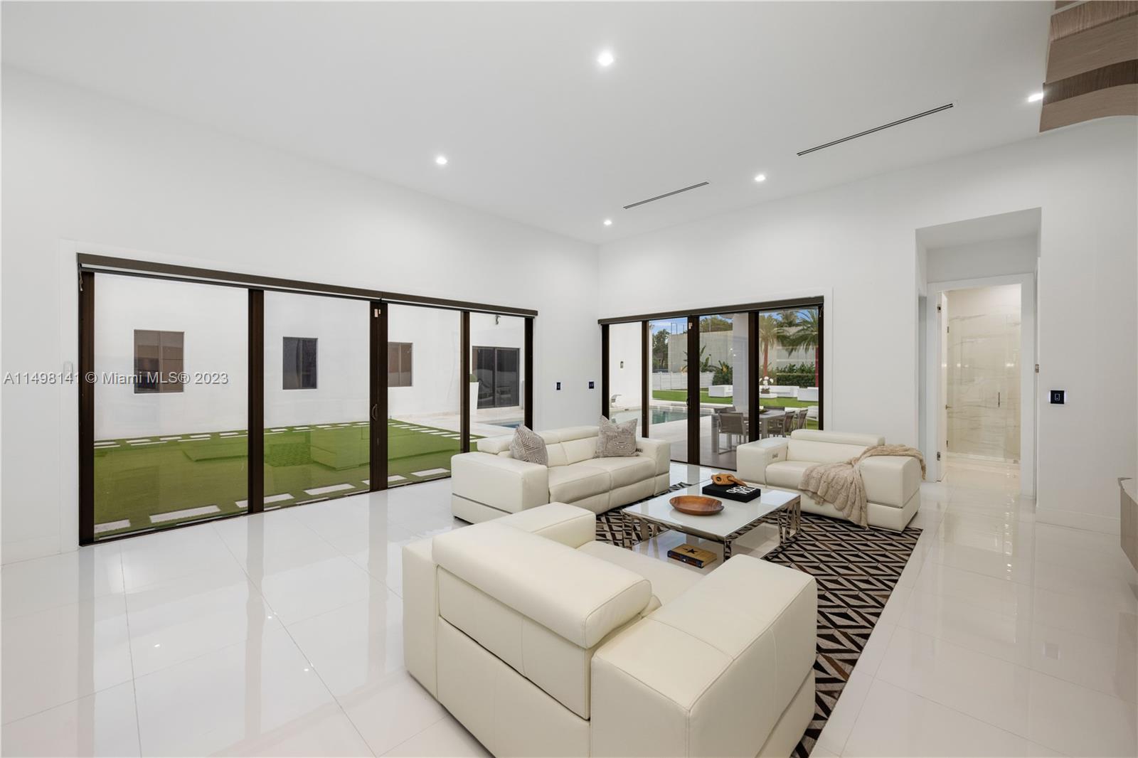 13310 Southwest 34th Street Miami, FL 33175 - Photo 51 of 54 a living room with furniture and large windows