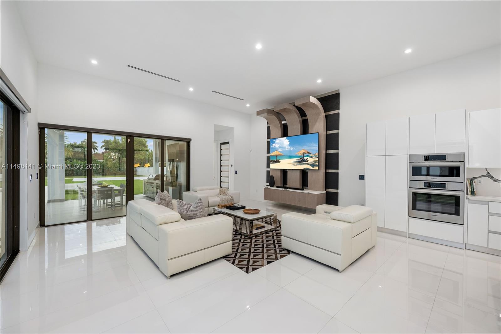 13310 Southwest 34th Street Miami, FL 33175 - Photo 7 of 54 a living room with furniture and a large window