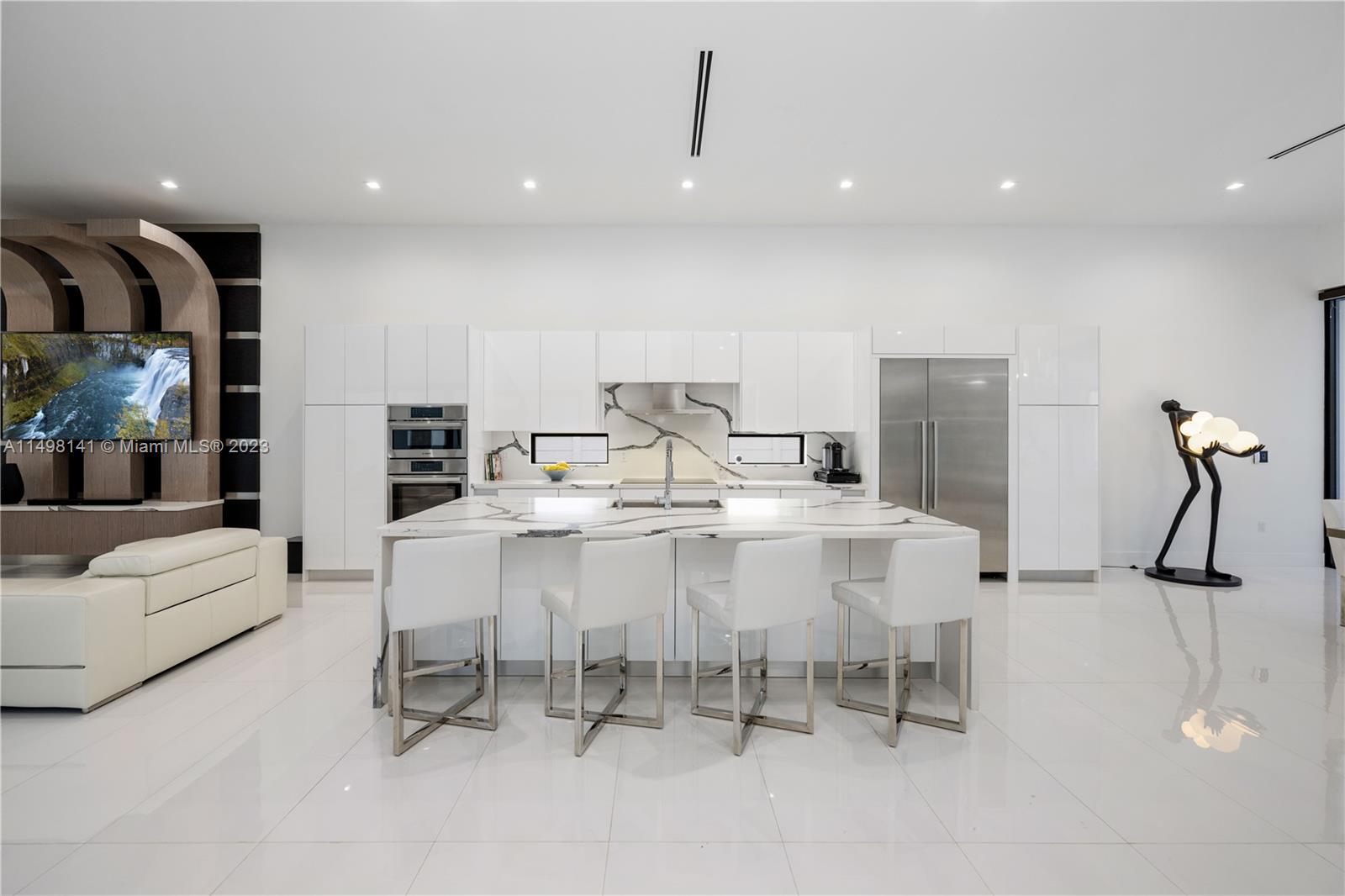 13310 Southwest 34th Street Miami, FL 33175 - Photo 10 of 54 a dining room with furniture and a chandelier
