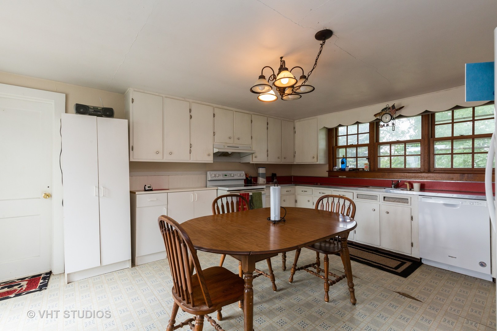 49W179 Main Street Road Maple Park, IL 60151 - Photo 4 of 21 a kitchen with a dining table chairs and refrigerator