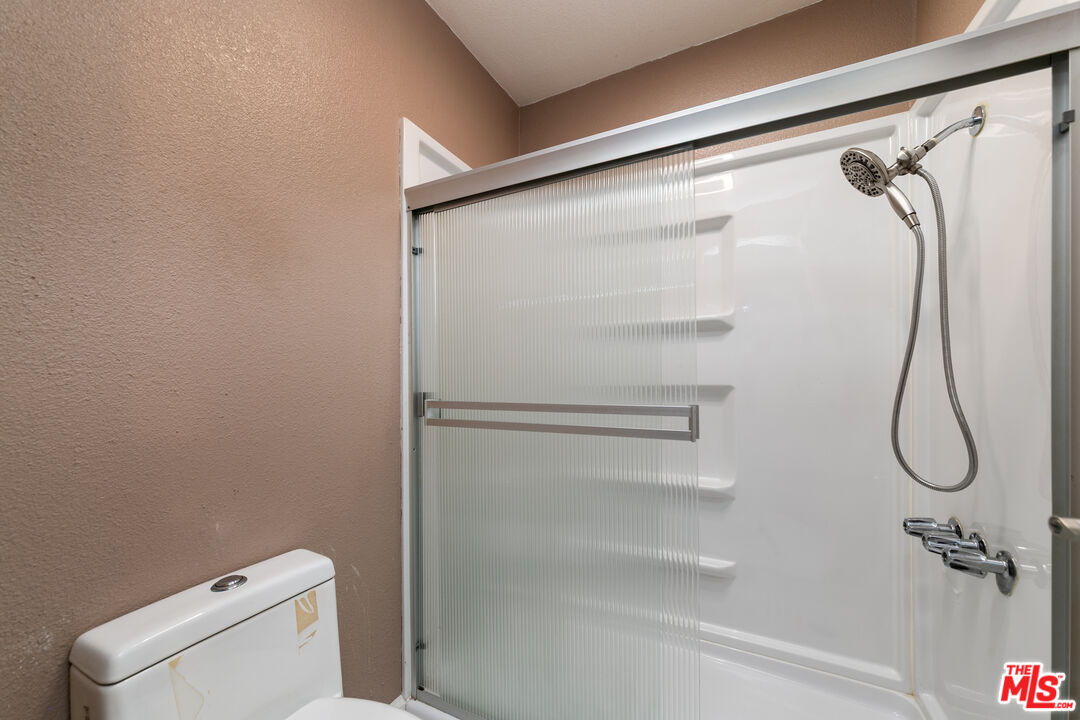 355 South Los Robles Avenue, Unit 108 Pasadena, CA 91101 - Photo 17 of 28 a bathroom with a shower