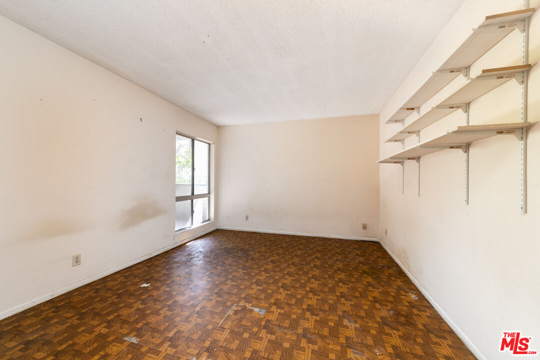 355 South Los Robles Avenue, Unit 108 Pasadena, CA 91101 - Photo 18 of 28 a view of an empty room with a window