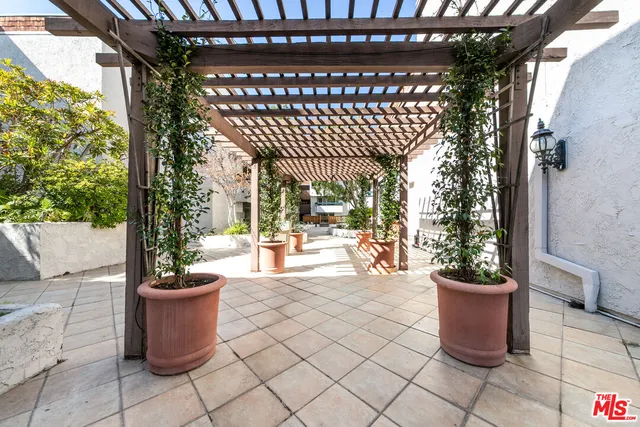 a view of a porch with seating space