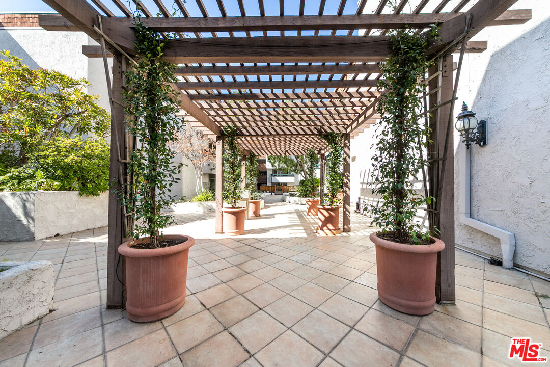 355 South Los Robles Avenue, Unit 108 Pasadena, CA 91101 - Photo 23 of 28 a view of a porch with seating space