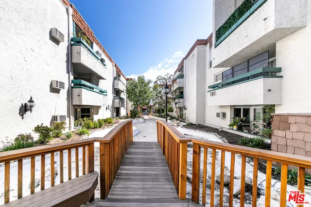 a view of a street with tall buildings