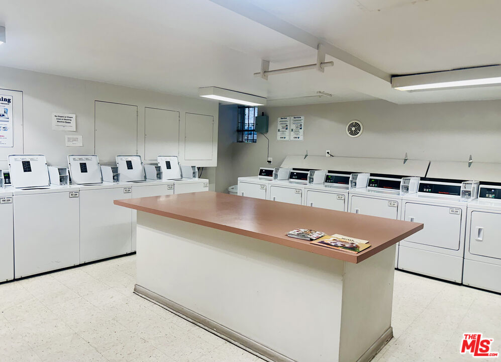 355 South Los Robles Avenue, Unit 108 Pasadena, CA 91101 - Photo 28 of 28 a kitchen with stainless steel appliances granite countertop a sink a stove and a refrigerator