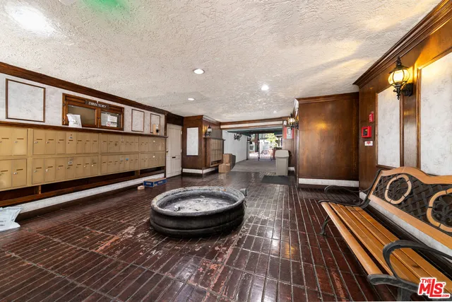 a room with wooden floor and furniture