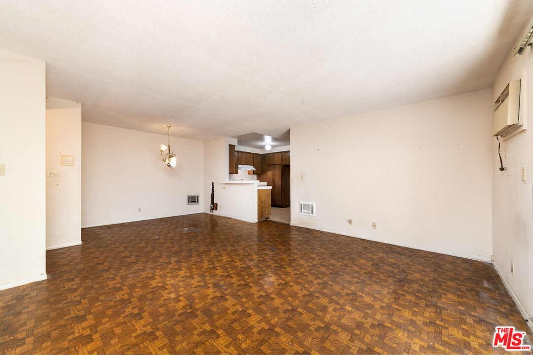 355 South Los Robles Avenue, Unit 108 Pasadena, CA 91101 - Photo 8 of 28 a view of empty room with wooden floor