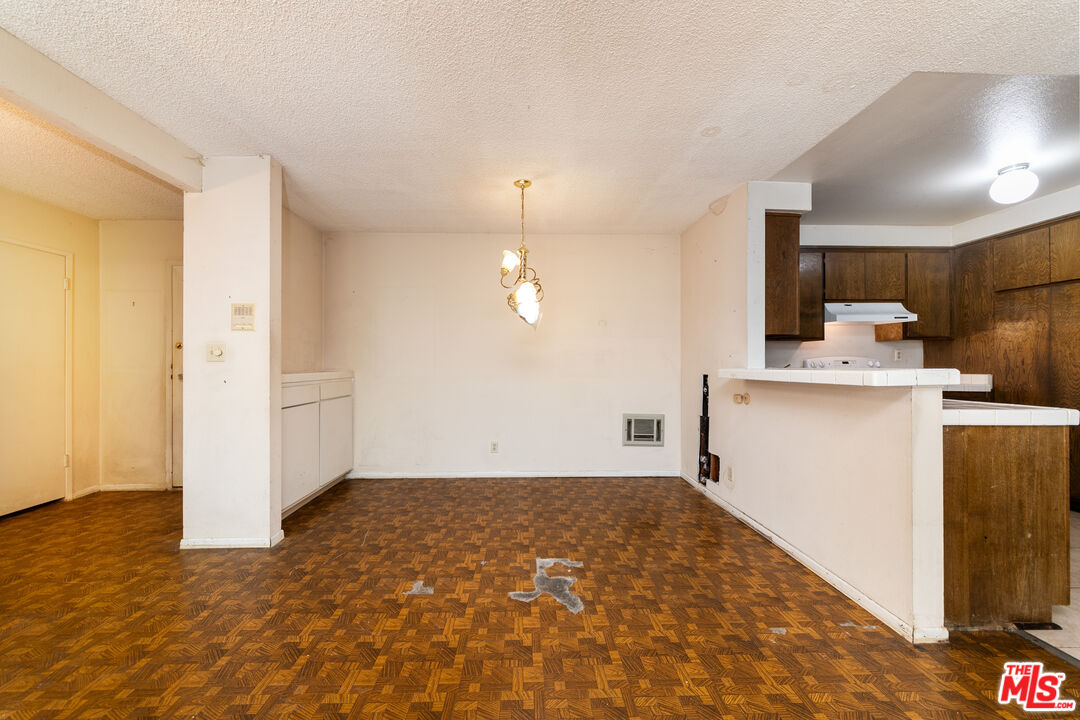 355 South Los Robles Avenue, Unit 108 Pasadena, CA 91101 - Photo 9 of 28 a very nice looking room with a wooden floors