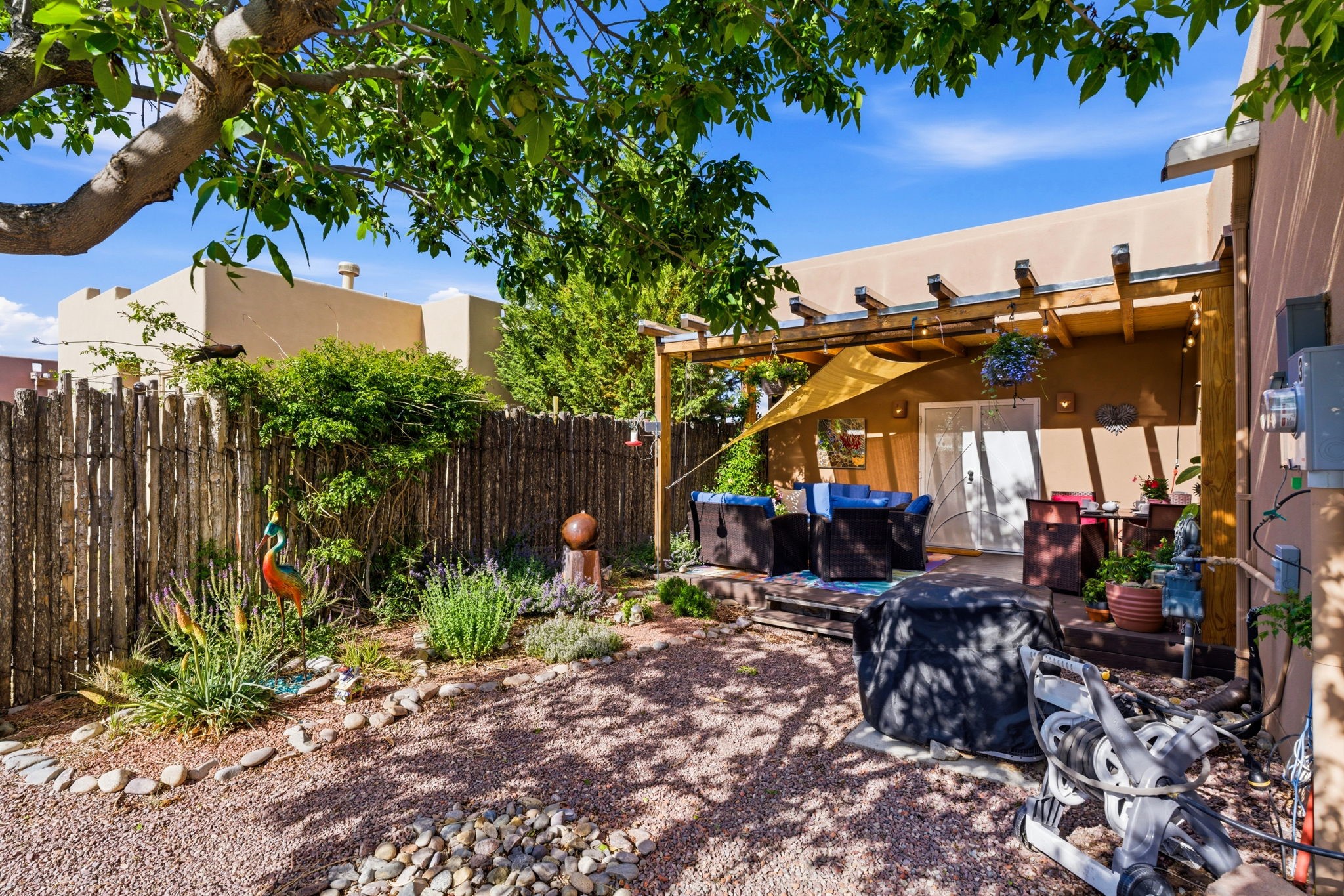 3 Silver Buckle Road Santa Fe, NM 87508 - Photo 30 of 34 Beautiful backyard with covered portal