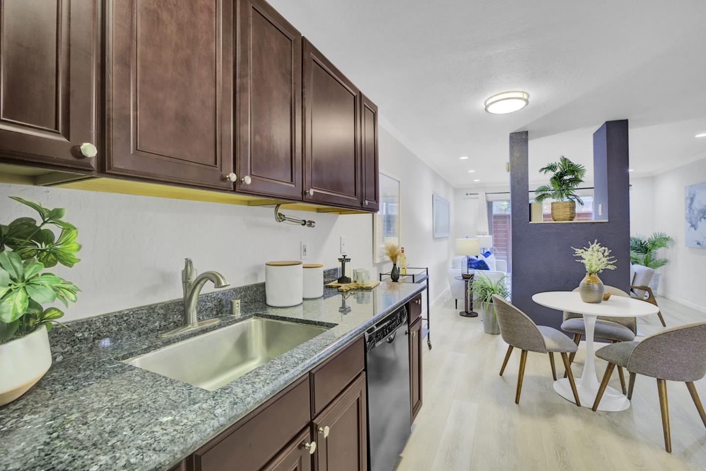 2742 Oak Road, Unit 191 Walnut Creek, CA 94597 - Photo 12 of 36 a kitchen with a sink cabinets and wooden floor