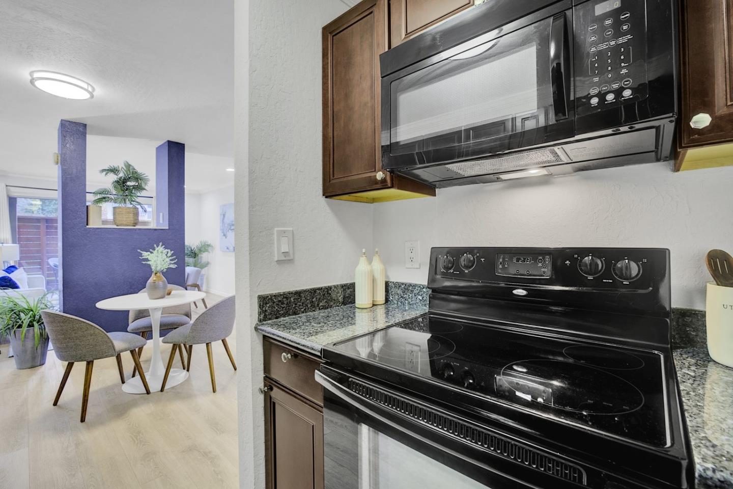 2742 Oak Road, Unit 191 Walnut Creek, CA 94597 - Photo 13 of 36 a kitchen with a stove and a microwave