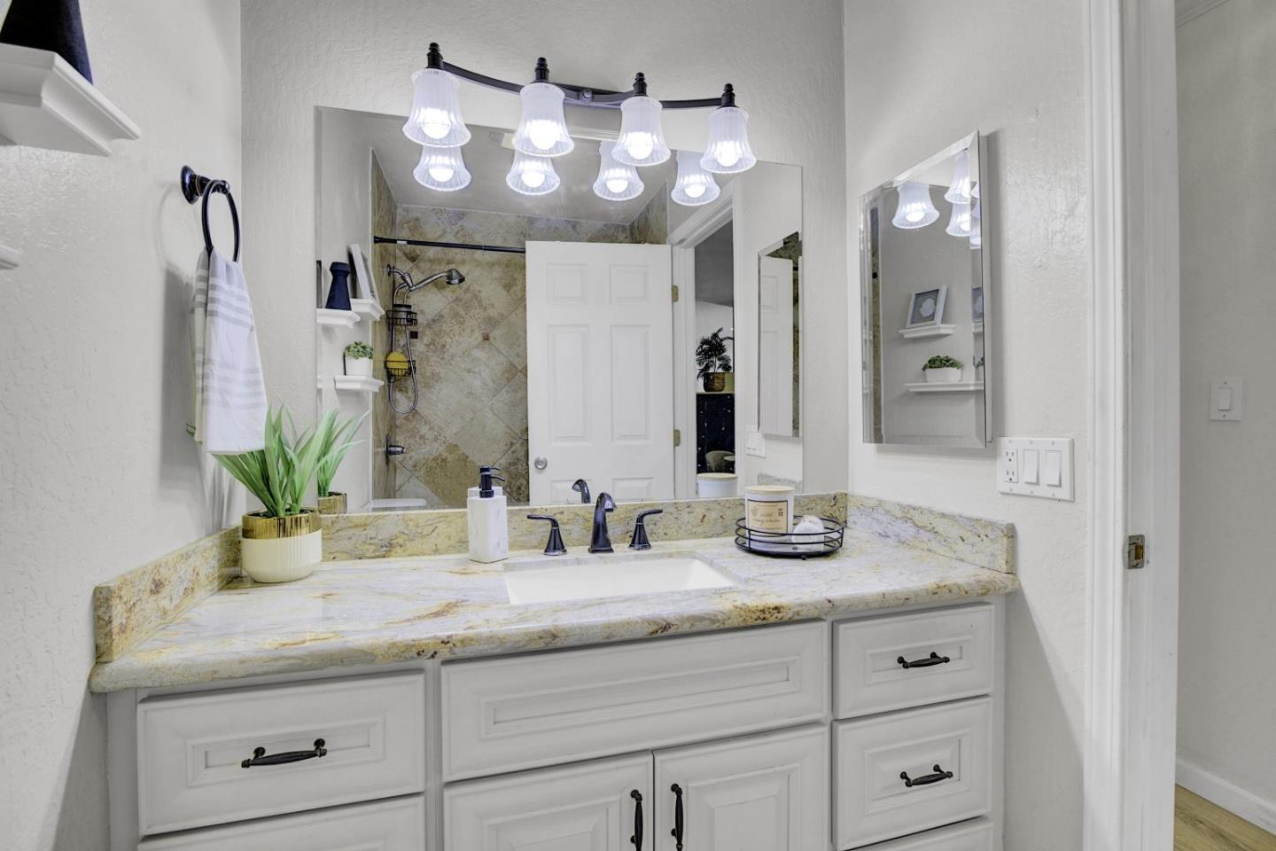 2742 Oak Road, Unit 191 Walnut Creek, CA 94597 - Photo 16 of 36 a bathroom with double vanity sink and a mirror
