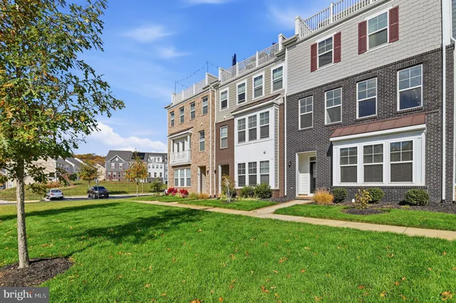 a front view of building with yard and green space