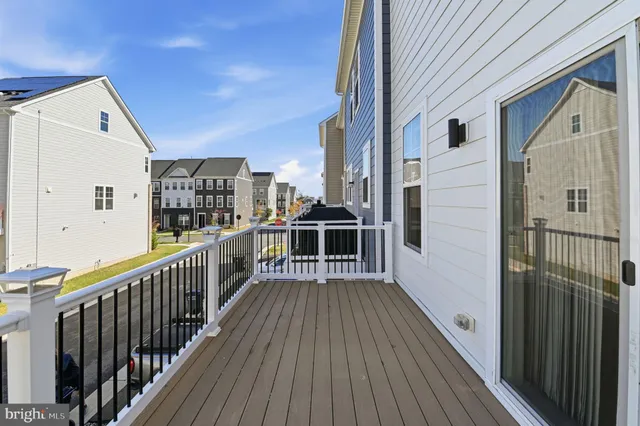 a view of a balcony with wooden floor