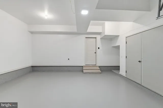 an empty room with shelves