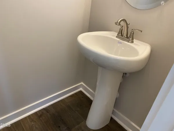 a bathroom with a sink and mirror