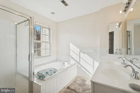 a bedroom with a bed and a shower